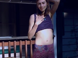 Cute Hippie Dancing In Skirt On Wooden Porch