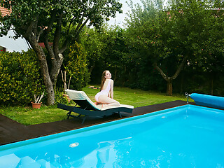 Petite Russian Marfa swims nude in the pool