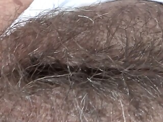 While I rest at the hotel on the beach, my boss films my big hairy pussy