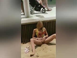 Horny Teen Masturbating On A Public Beach