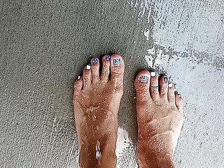 Showing off our feet and pedicures while wet